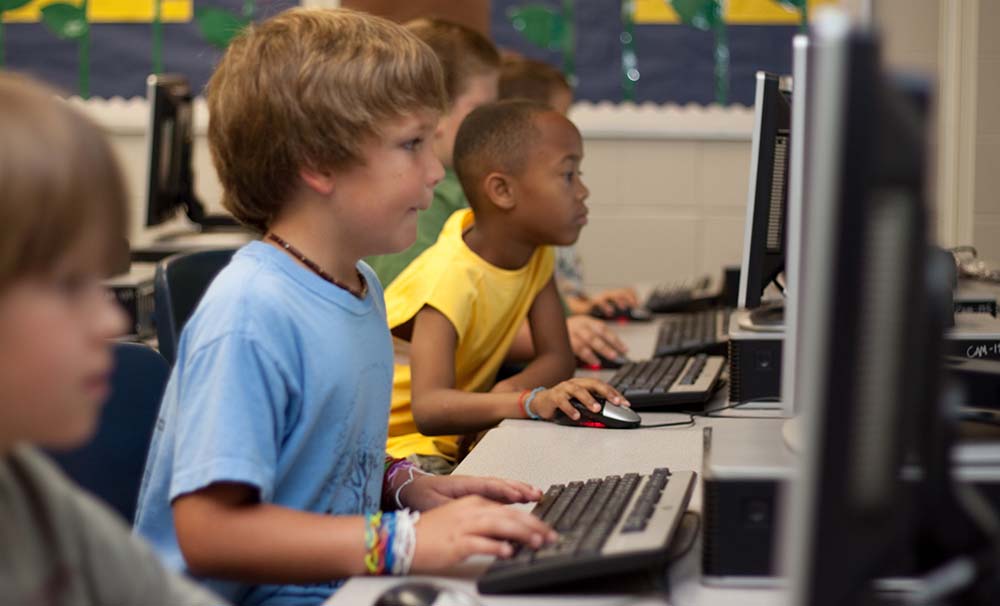 children in a classroom having fun learning